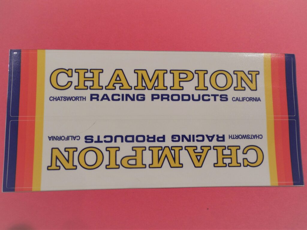 Champion swing arm sticker, 9″ × 2″